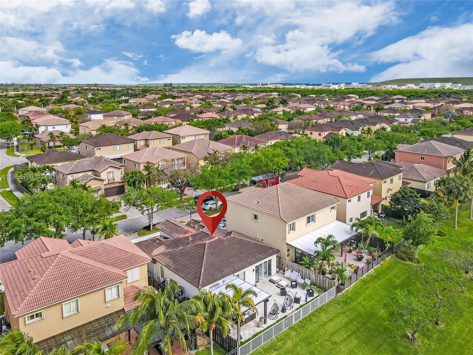 22438 Southwest 94th Path Cutler Bay, FL 33190 - Photo 34 of 38 an aerial view of residential houses with outdoor space
