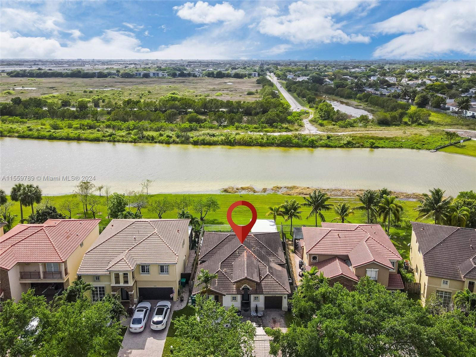 22438 Southwest 94th Path Cutler Bay, FL 33190 - Photo 36 of 38 an aerial view of residential houses with outdoor space and ocean view