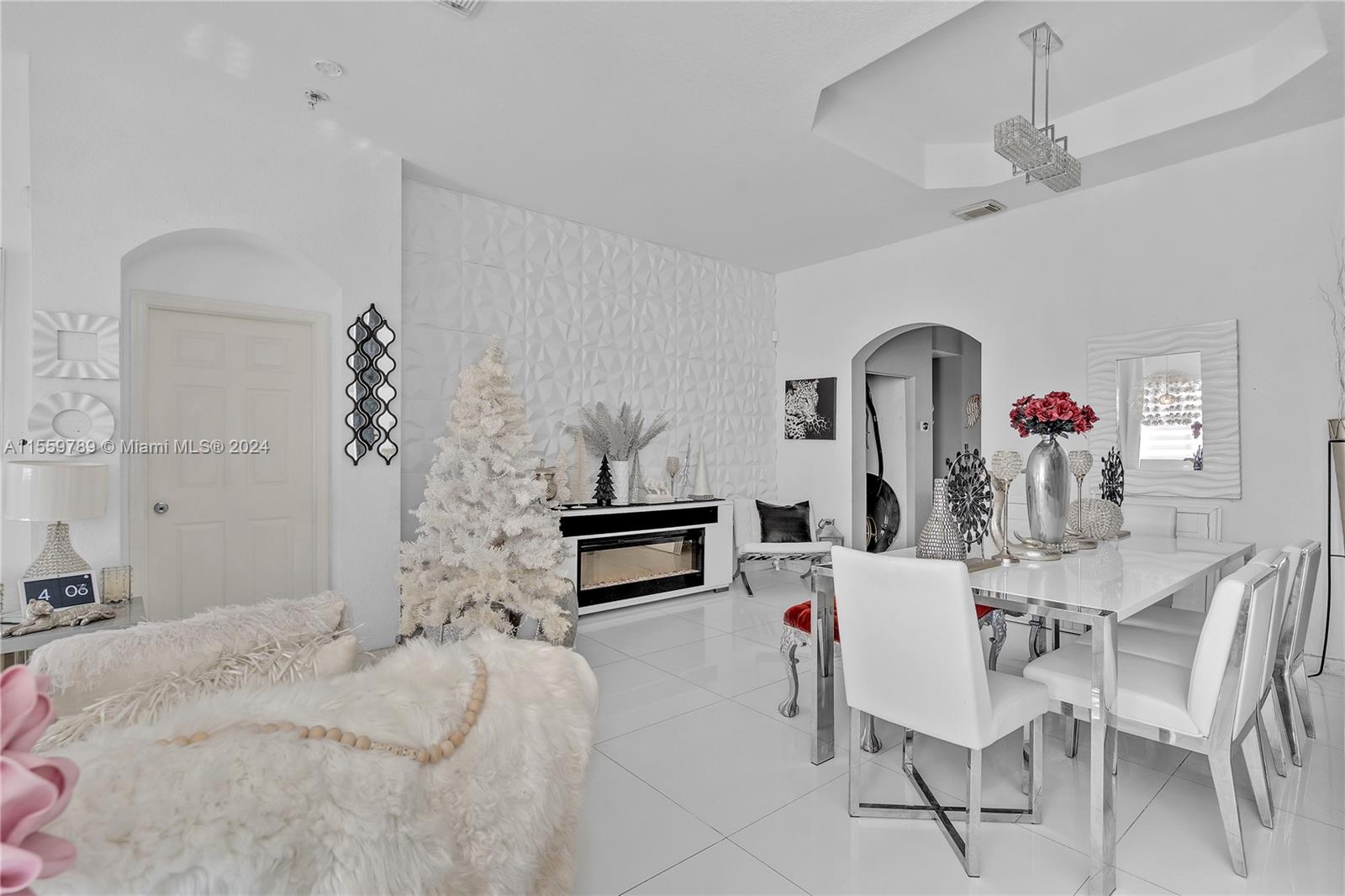 22438 Southwest 94th Path Cutler Bay, FL 33190 - Photo 6 of 38 a living room with fireplace furniture and decor