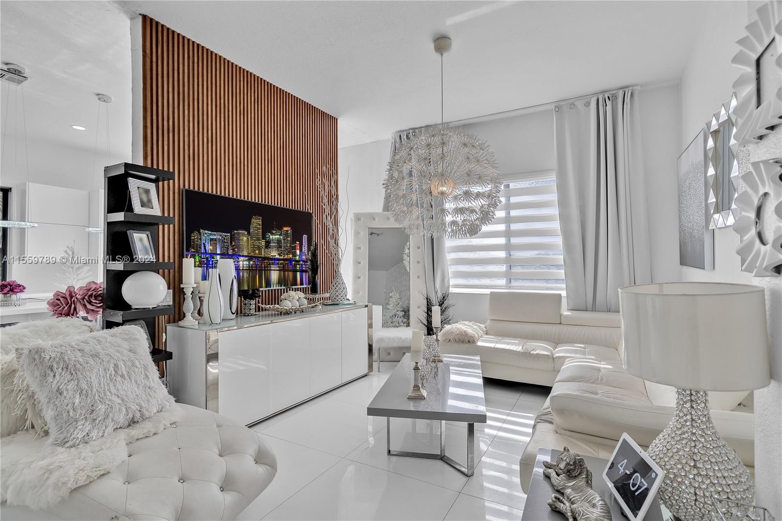 22438 Southwest 94th Path Cutler Bay, FL 33190 - Photo 7 of 38 a living room with furniture and a large window