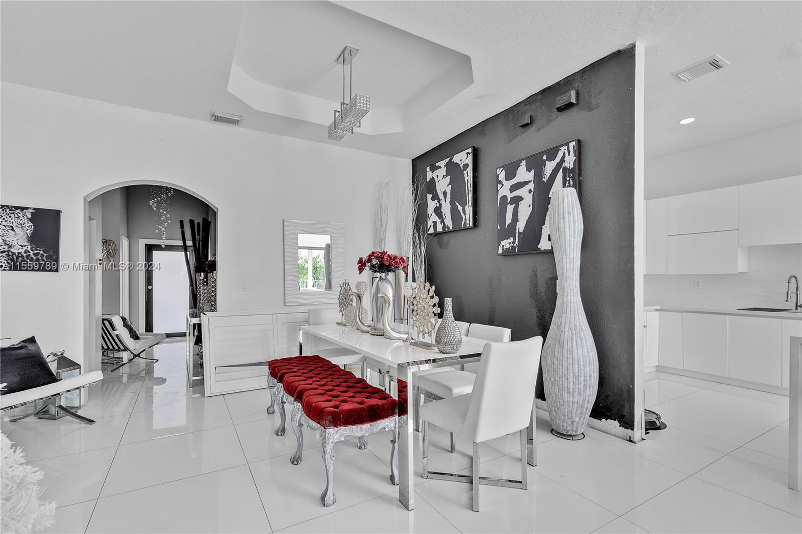 22438 Southwest 94th Path Cutler Bay, FL 33190 - Photo 9 of 38 a living room with furniture a dining table and chairs with wooden floor