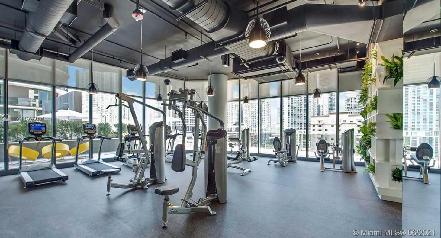45 Southwest 9th Street, Unit 3102 Miami, FL 33130 - Photo 15 of 19 a view of a room with gym equipment