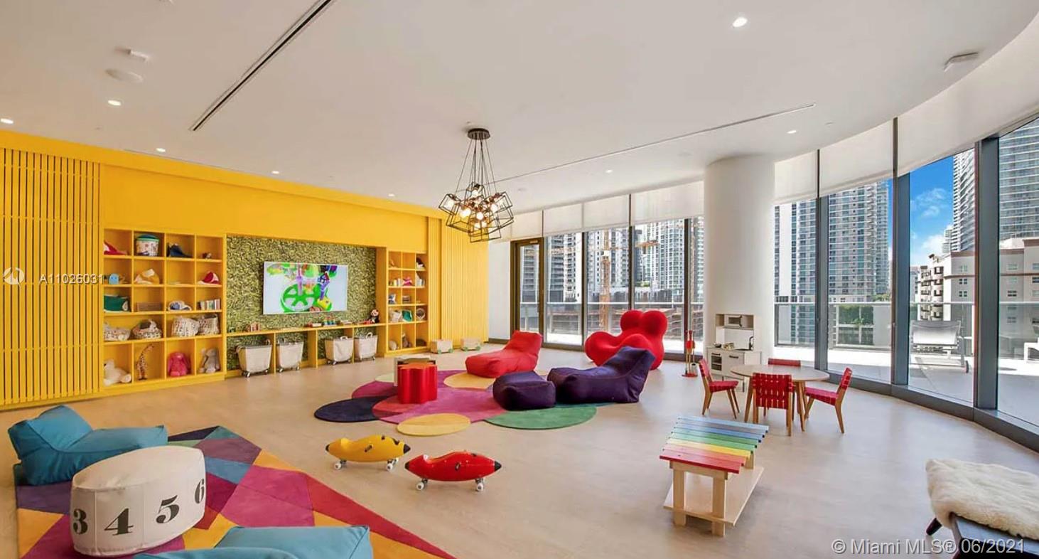 45 Southwest 9th Street, Unit 3102 Miami, FL 33130 - Photo 19 of 19 a living room with furniture and a flat screen tv