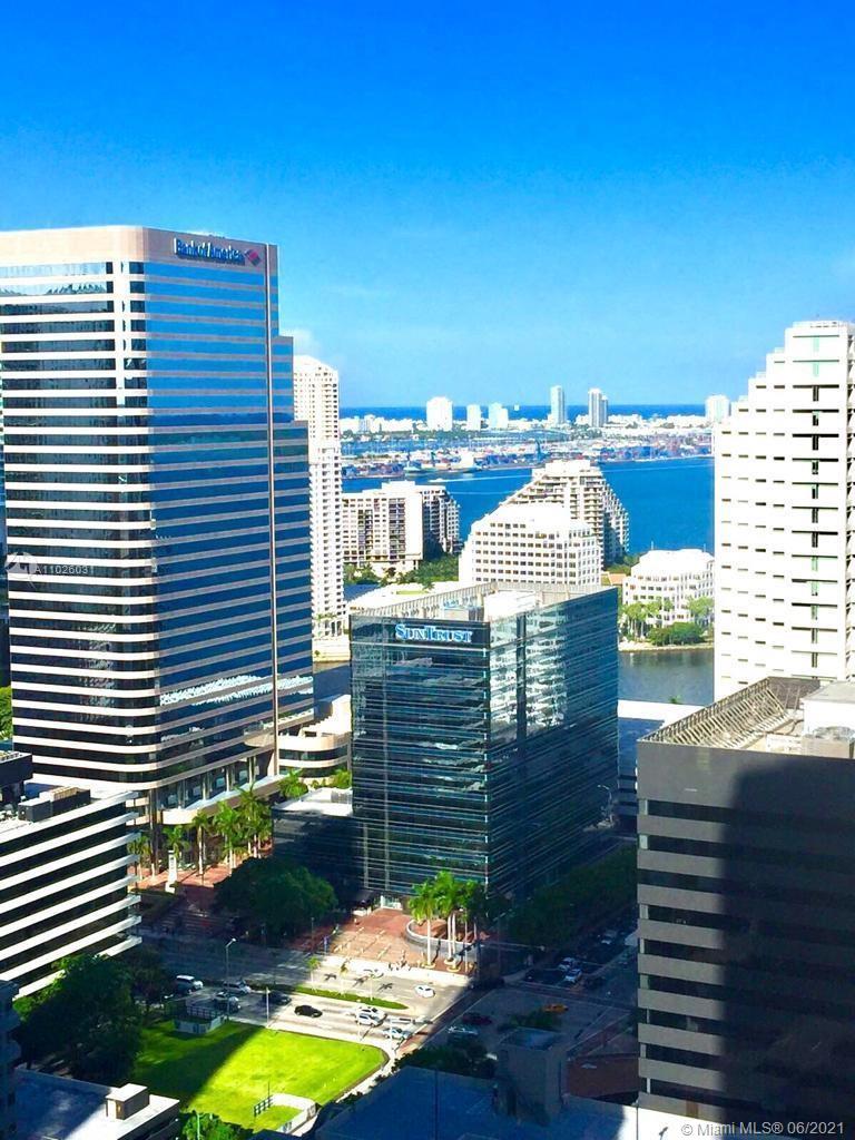 45 Southwest 9th Street, Unit 3102 Miami, FL 33130 - Photo 10 of 19 a view of a balcony with two chairs