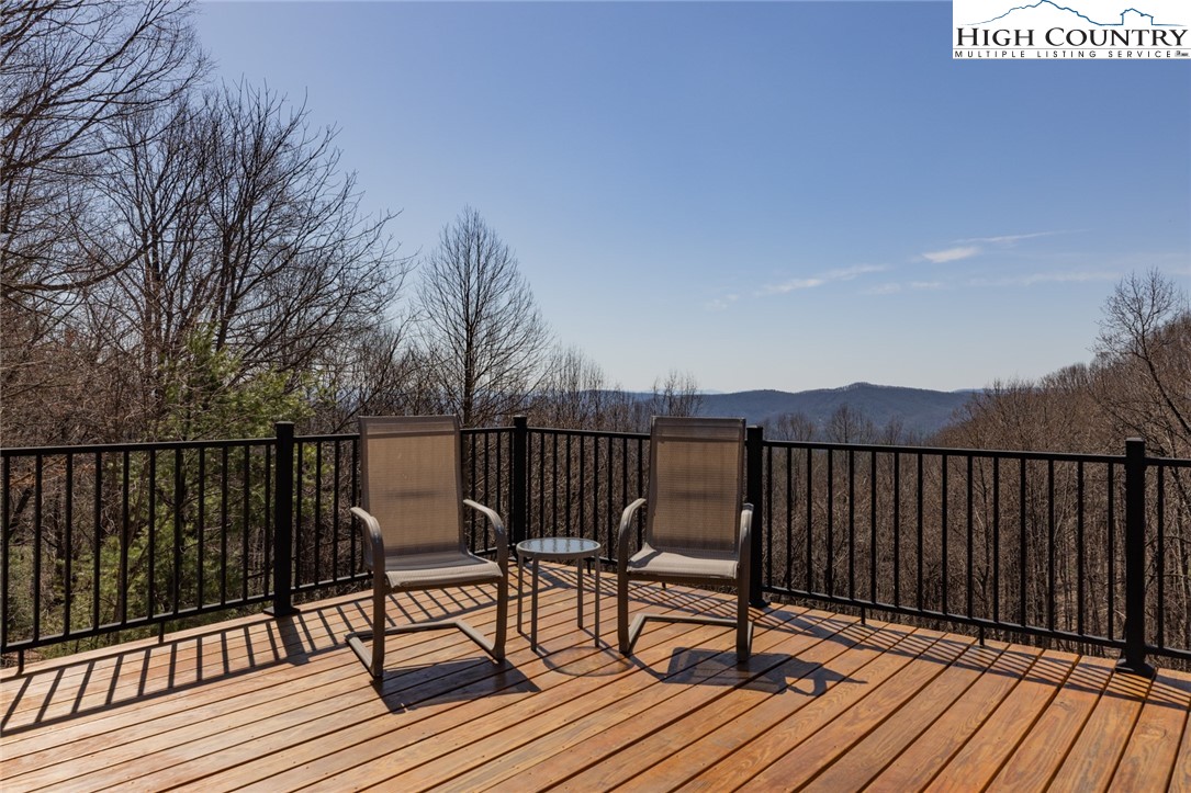 181 Abbey Road McGrady, NC 28649 - Photo 11 of 50 a view of balcony with wooden floor and outdoor seating