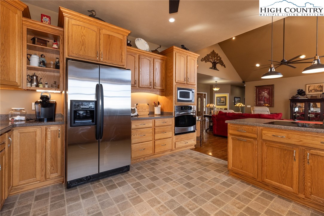 181 Abbey Road McGrady, NC 28649 - Photo 21 of 50 a kitchen with stainless steel appliances granite countertop a refrigerator a oven a sink and dishwasher