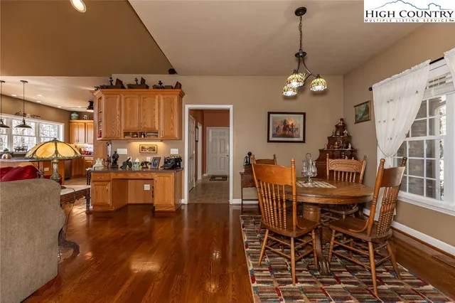 a bedroom with a bed chair and window