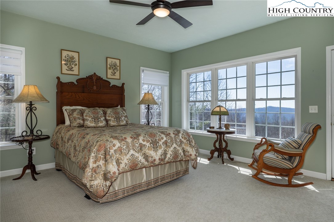 181 Abbey Road McGrady, NC 28649 - Photo 25 of 50 a bedroom with a bed chair and window