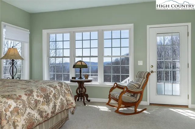 a bathroom with a bathtub sink and mirror