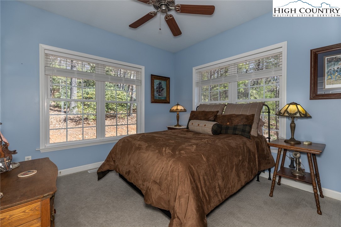 181 Abbey Road McGrady, NC 28649 - Photo 35 of 50 a bed room with a bed and a window