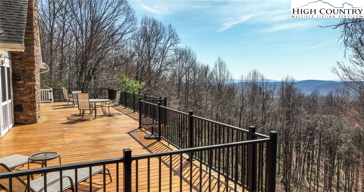181 Abbey Road McGrady, NC 28649 - Photo 4 of 50 a view of roof deck with chairs and wooden fence