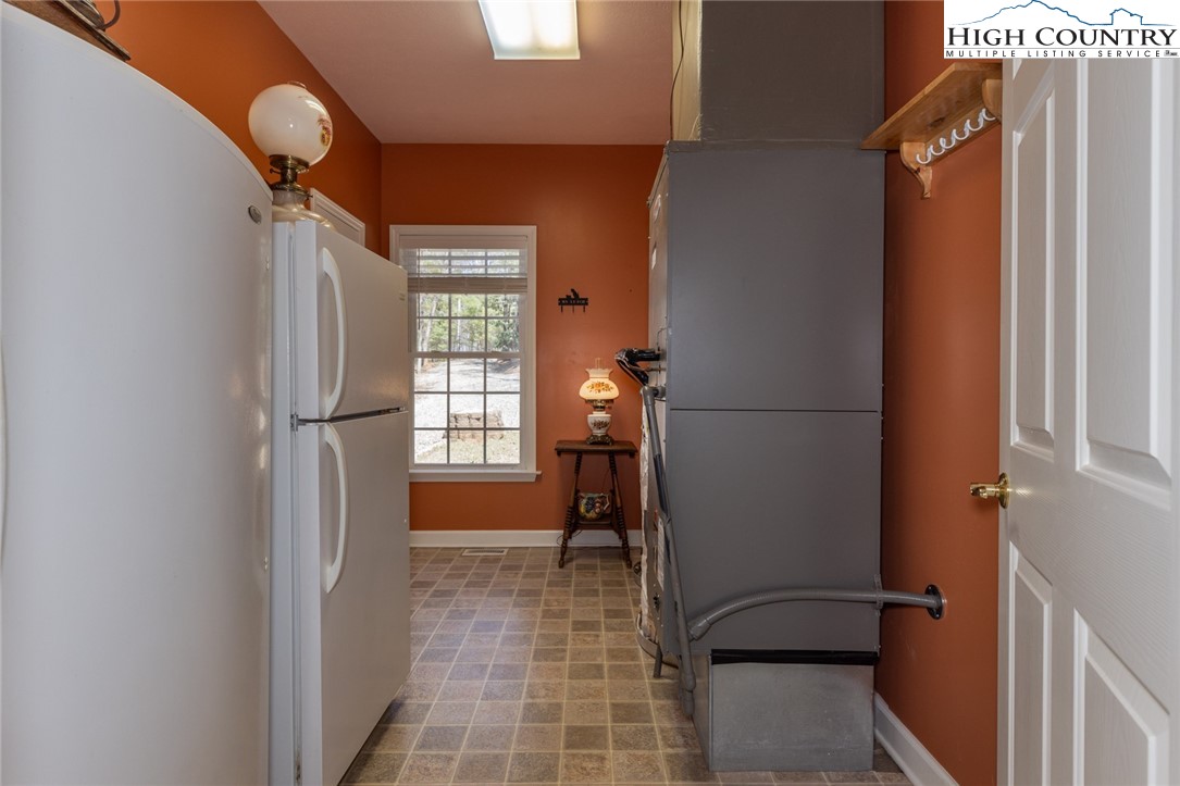 181 Abbey Road McGrady, NC 28649 - Photo 43 of 50 a view of a hallway with wooden shelves