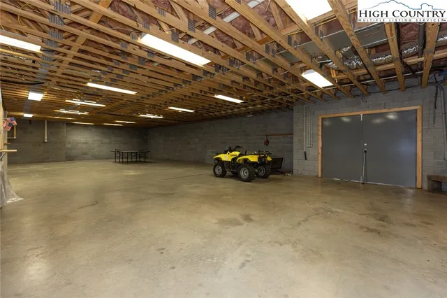 a view of empty room with wooden ceiling