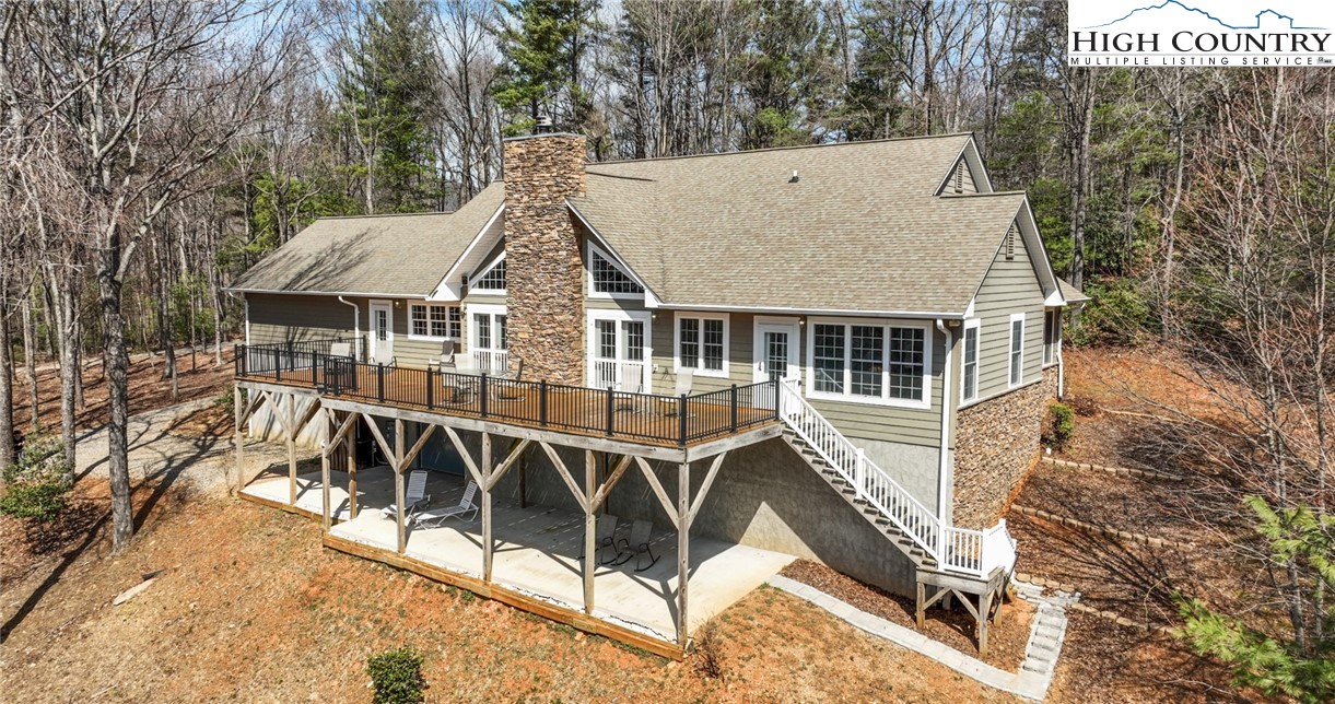 181 Abbey Road McGrady, NC 28649 - Photo 10 of 50 a view of a house with backyard porch and sitting area
