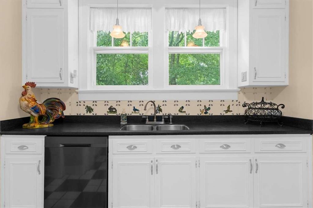 106 Westmore Road Southwest Rome, GA 30165 - Photo 15 of 56 a kitchen with granite countertop white cabinets a window and a sink