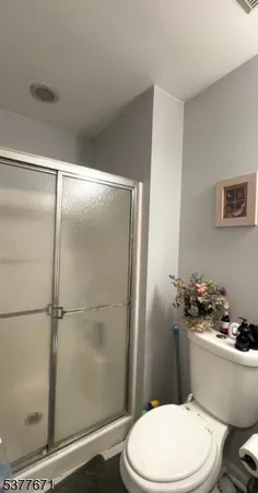 a white toilet sitting next to a bathroom sink