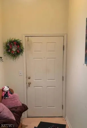 a bedroom with a bed and a hallway