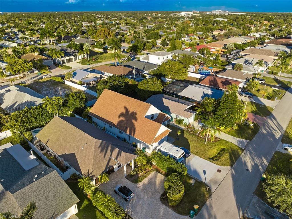 739 102nd Avenue North Naples, FL 34108 - Photo 4 of 20 an aerial view of residential houses with outdoor space