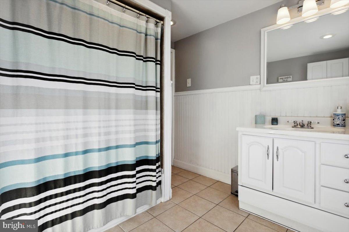 214 Ripka Street Philadelphia, PA 19127 - Photo 10 of 15 a bathroom with a sink and a mirror