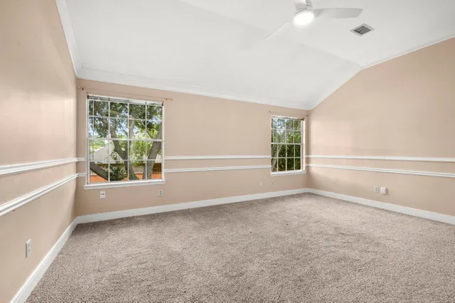 a spacious bathroom with a tub a sink and mirror