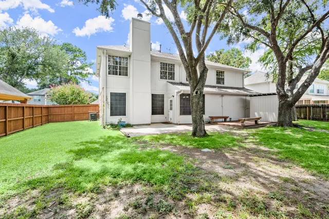 a backyard of a house with lots of green space