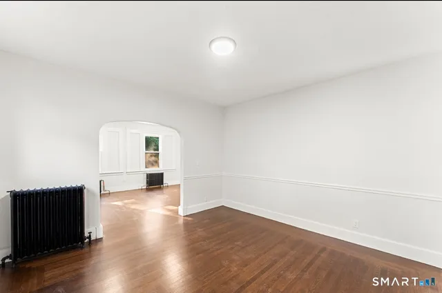 a view of a livingroom with wooden floor