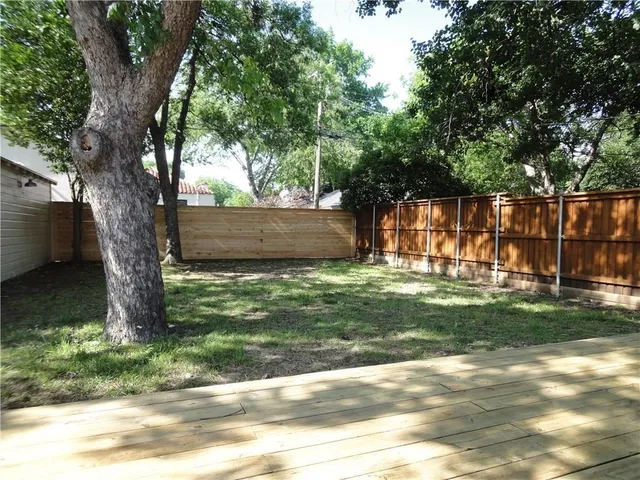 a view of backyard with green space