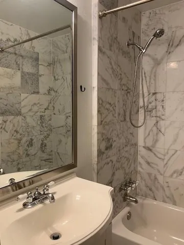 a bathroom with a sink and a shower