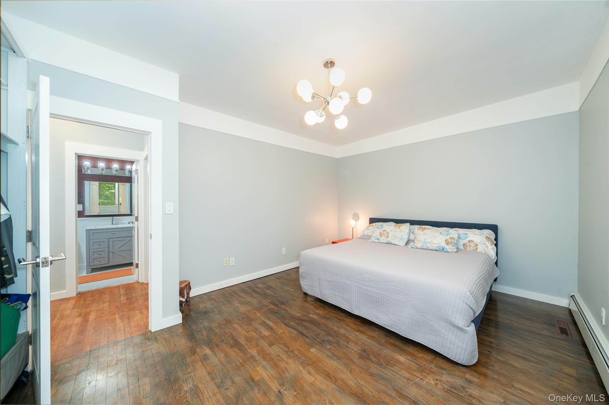 4 Half Mile Road Armonk, NY 10504 - Photo 15 of 28 Generously sized second bedroom with warm hardwood floors, high ceilings, and abundant natural light.