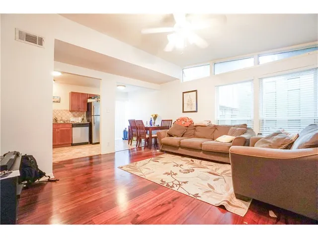 a living room with furniture window and a table