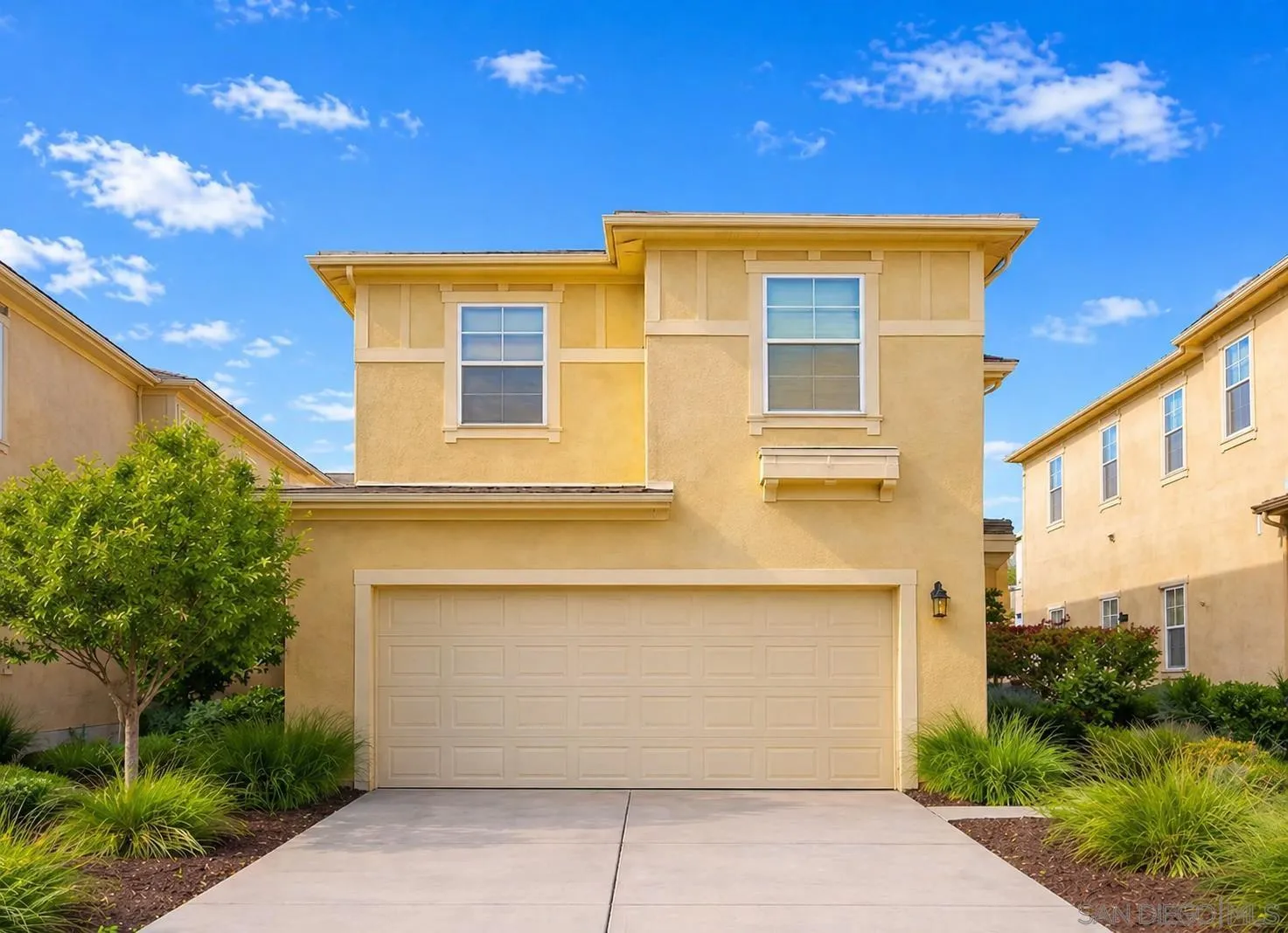 Great light and bright curb appeal with lush landscaping and full 2 car garage and driveway space for two additional vehicles.