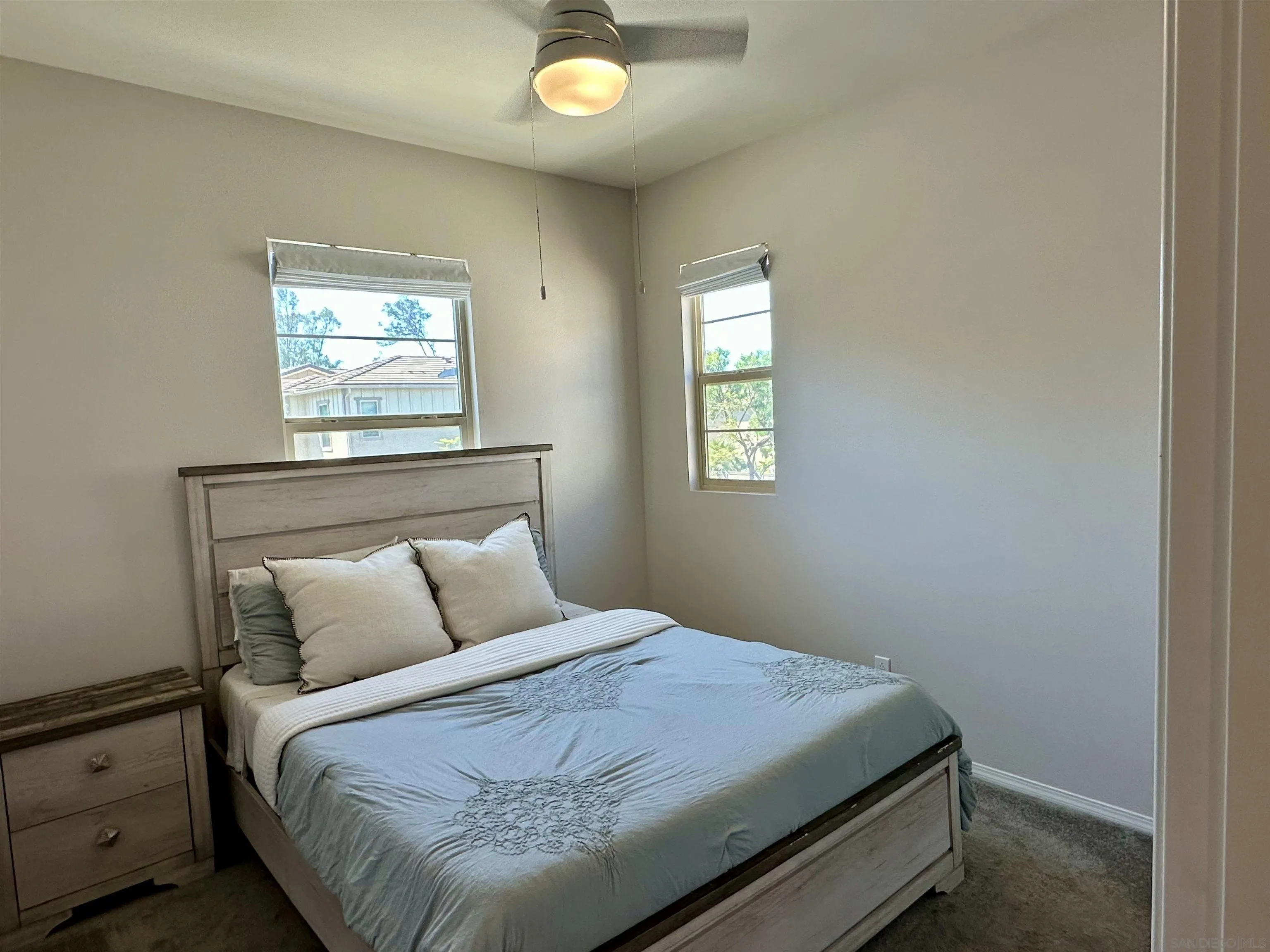 1132 Cherry Tree Lane Vista, CA 92084 - Photo 10 of 26 Bedroom 3 is also 10 x 10, sunkissed from the south so it stays cool and has an upgraded, lighted ceiling fan