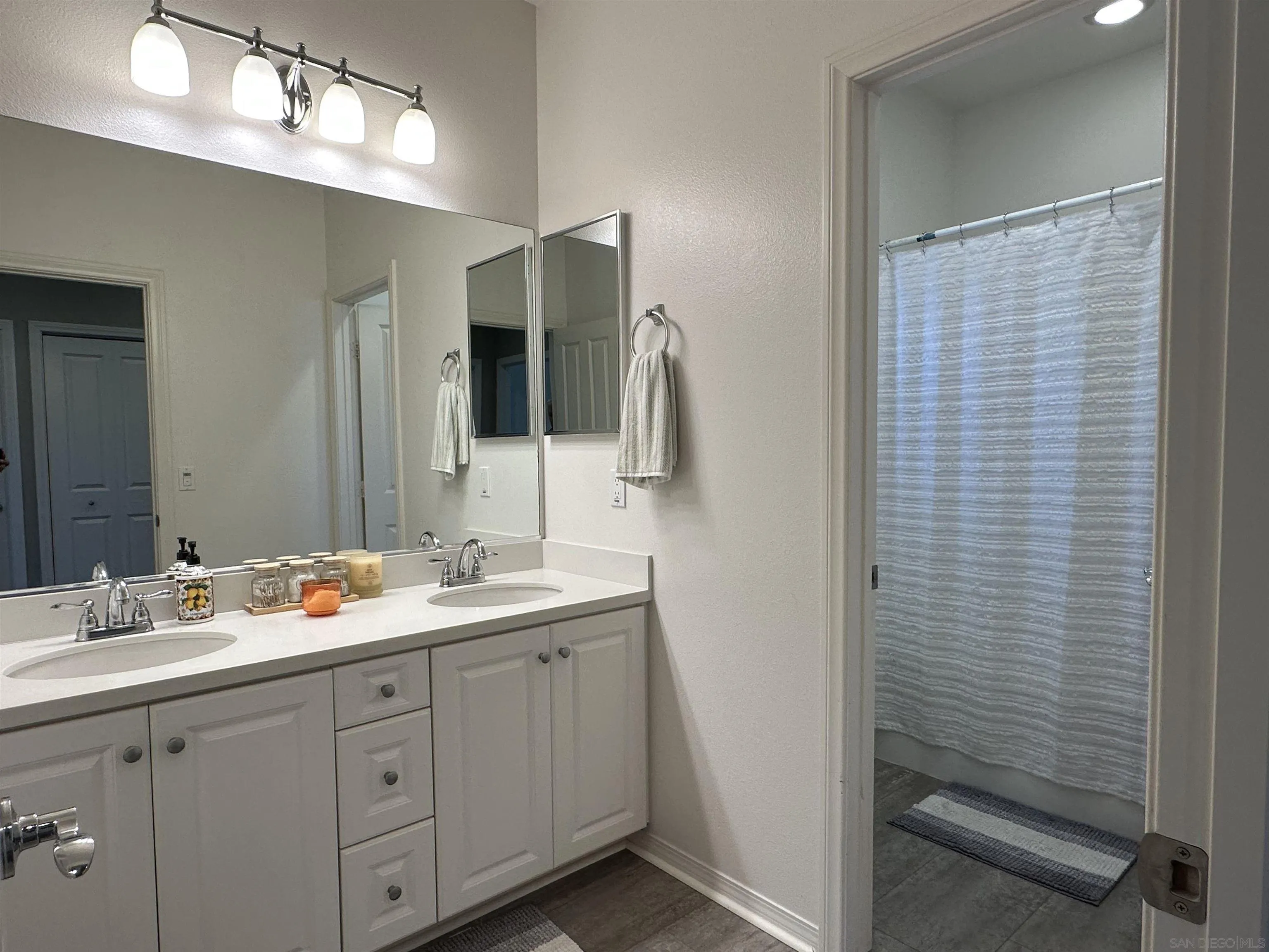 1132 Cherry Tree Lane Vista, CA 92084 - Photo 14 of 28 Bath is light and bright with double vanity and shower