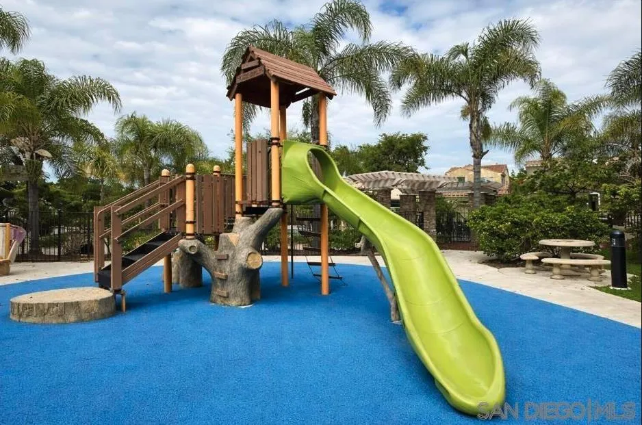 1132 Cherry Tree Lane Vista, CA 92084 - Photo 21 of 28 Epic play structure with climb and slide elements. Ground is padded for safety and there is nearby seating so you can keep an eye on the kiddos.