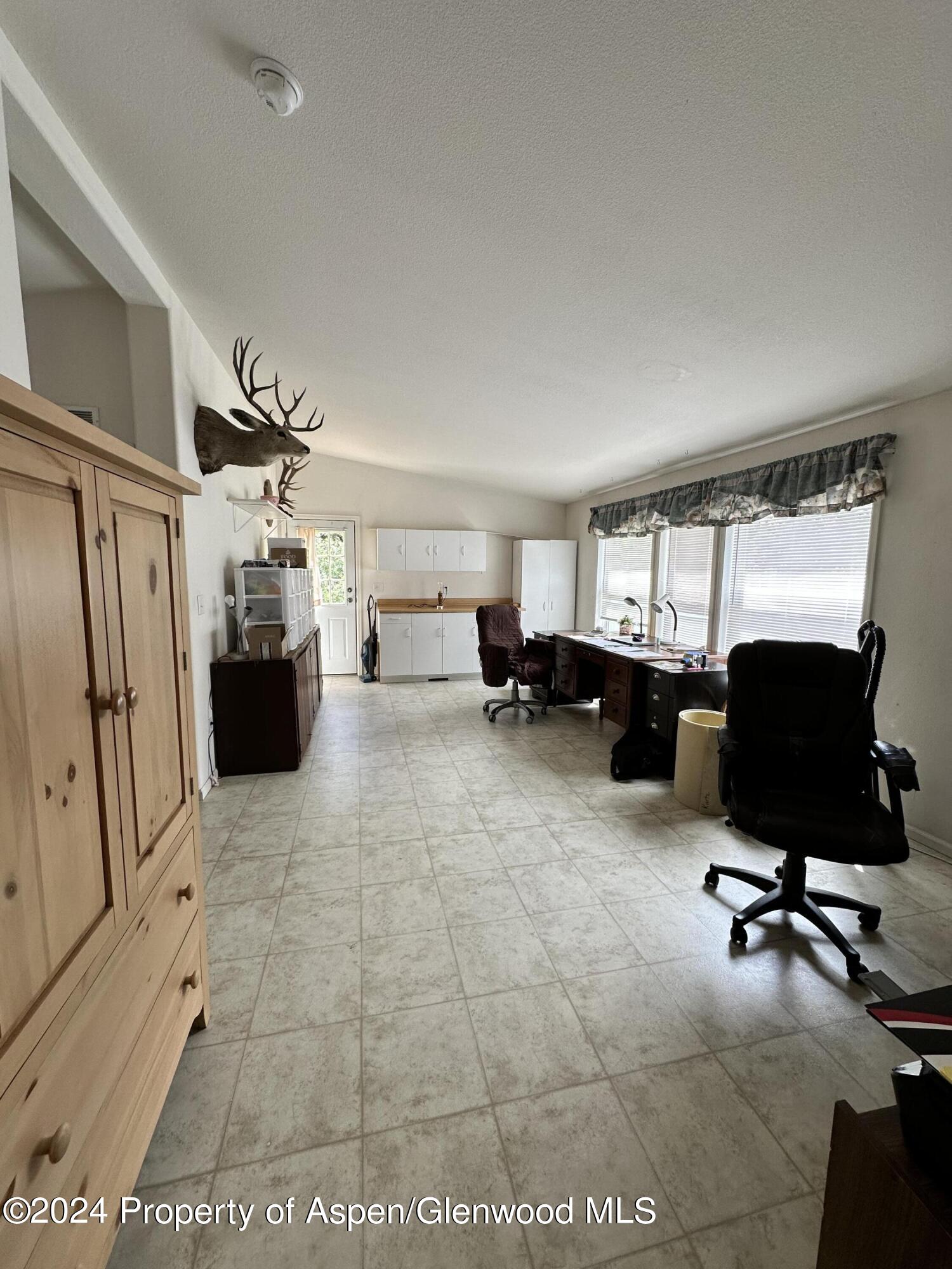 220 Clark Drive El Jebel, CO 81621 - Photo 8 of 12 a view of a livingroom with workspace and a couch