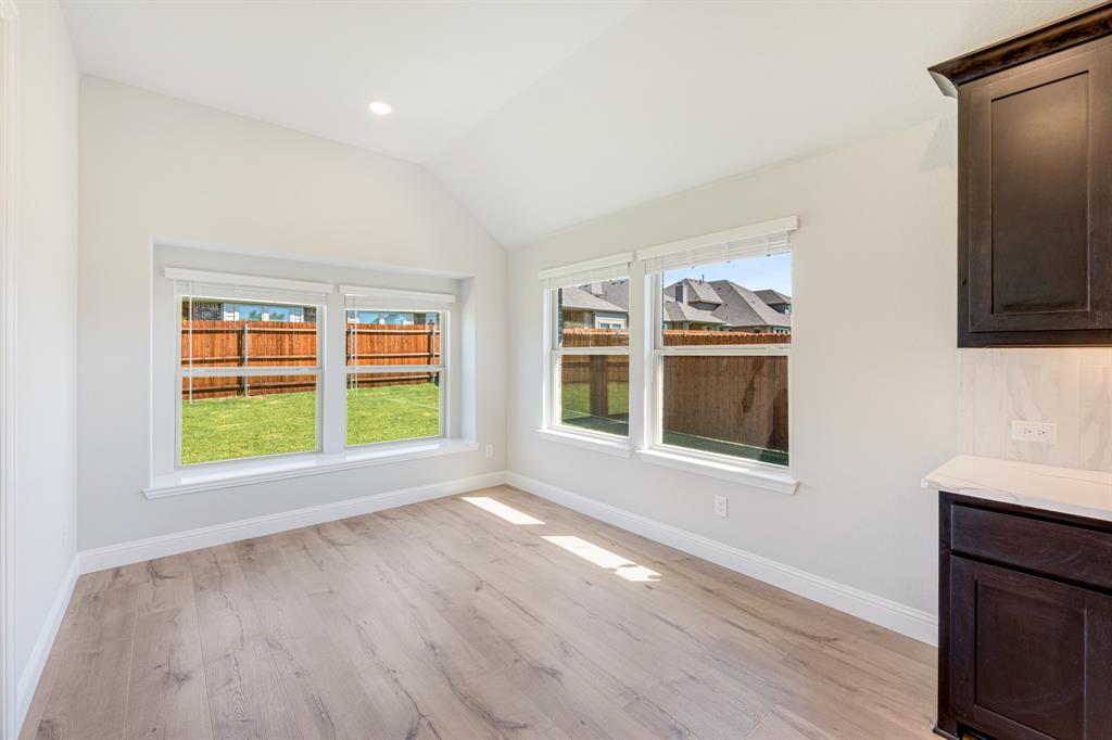 1025 Raptor Road Alvarado, TX 76009 - Photo 15 of 40 a view of an empty room with a window and wooden floor