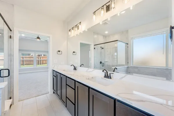 a bathroom with a tub and a shower