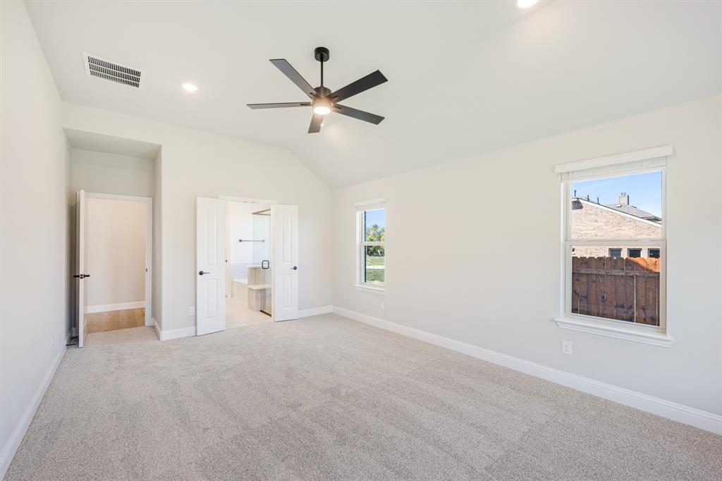 1025 Raptor Road Alvarado, TX 76009 - Photo 22 of 40 a view of a livingroom with a ceiling fan and window