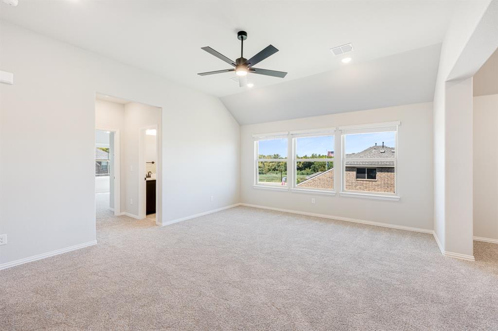 1025 Raptor Road Alvarado, TX 76009 - Photo 25 of 40 a view of a livingroom with a ceiling fan and window