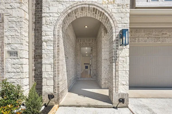 an entryway in a hall with a window