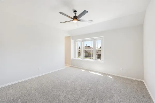 a bathroom with a sink vanity granite tub shower and a mirror