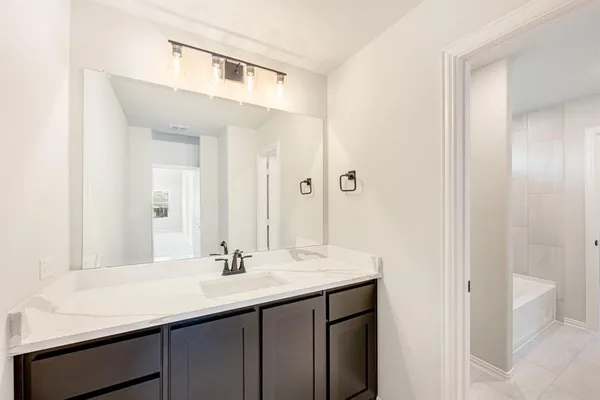 a bed room with a bed and a window