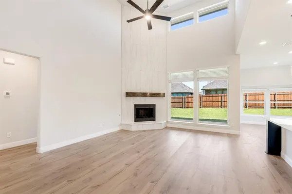 a living room with furniture a rug and a fireplace