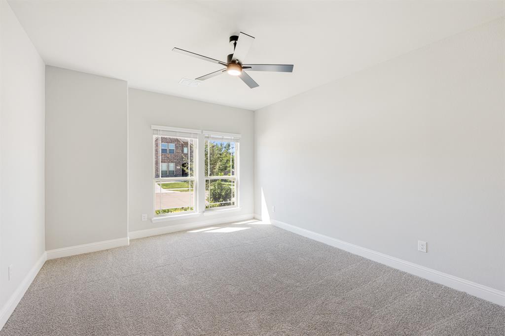 1025 Raptor Road Alvarado, TX 76009 - Photo 5 of 40 an empty room with windows and fan