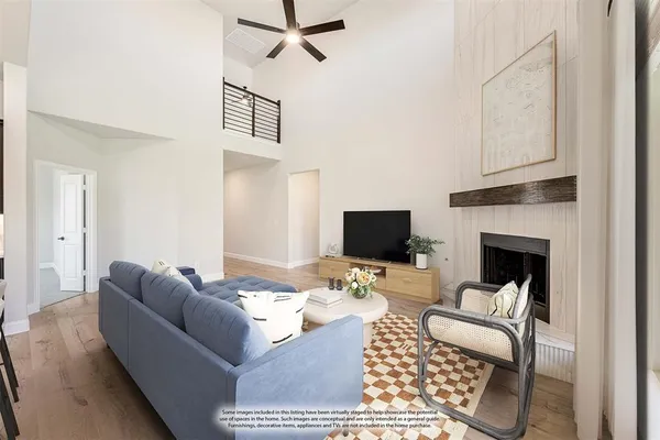 a view of a kitchen with a sink a fireplace and a window