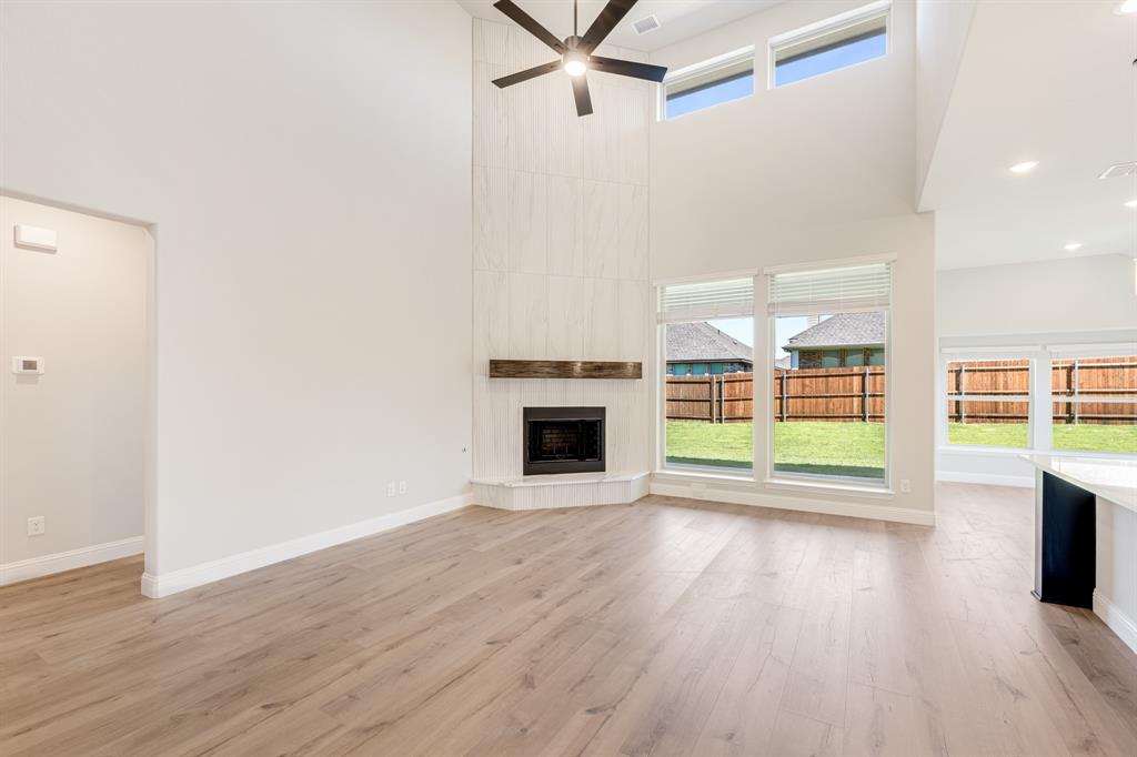 1025 Raptor Road Alvarado, TX 76009 - Photo 9 of 40 a view of empty room with wooden floor and fireplace