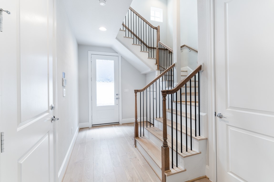 819 Bringhurst Street Houston, TX 77020 - Photo 3 of 17 a view of a hallway with wooden floor and entryway
