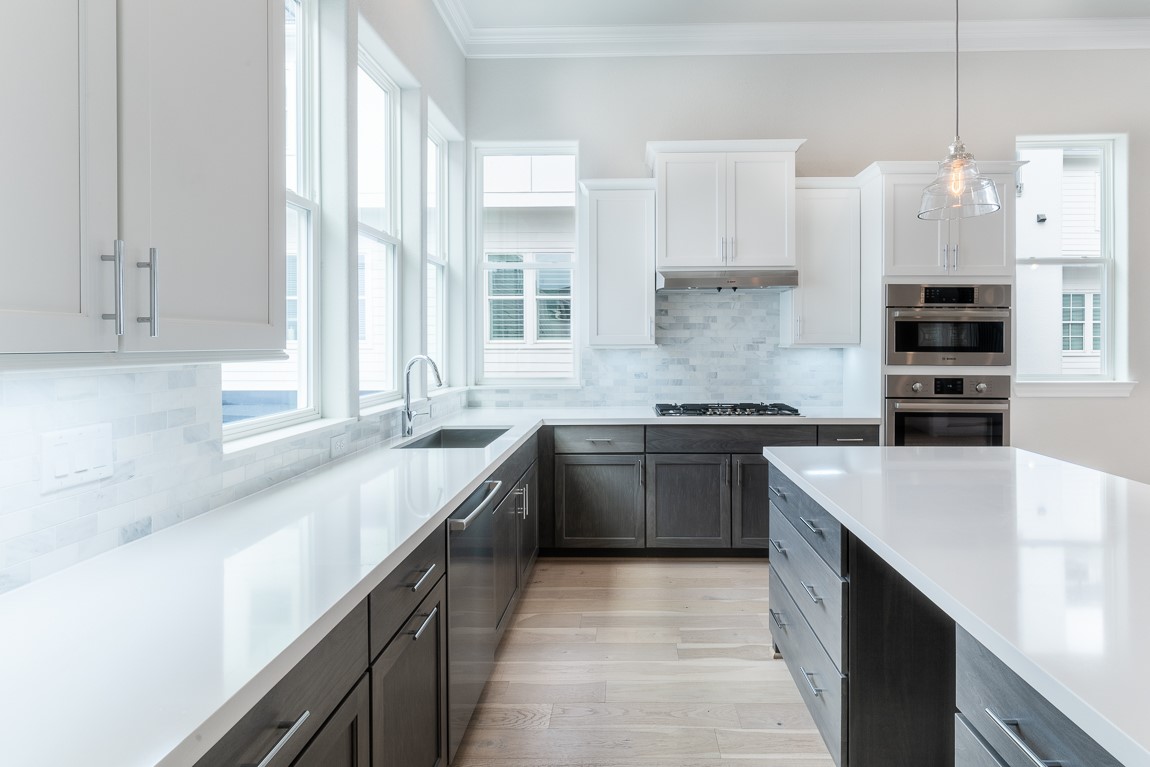 819 Bringhurst Street Houston, TX 77020 - Photo 6 of 17 a kitchen with a sink stove and cabinets