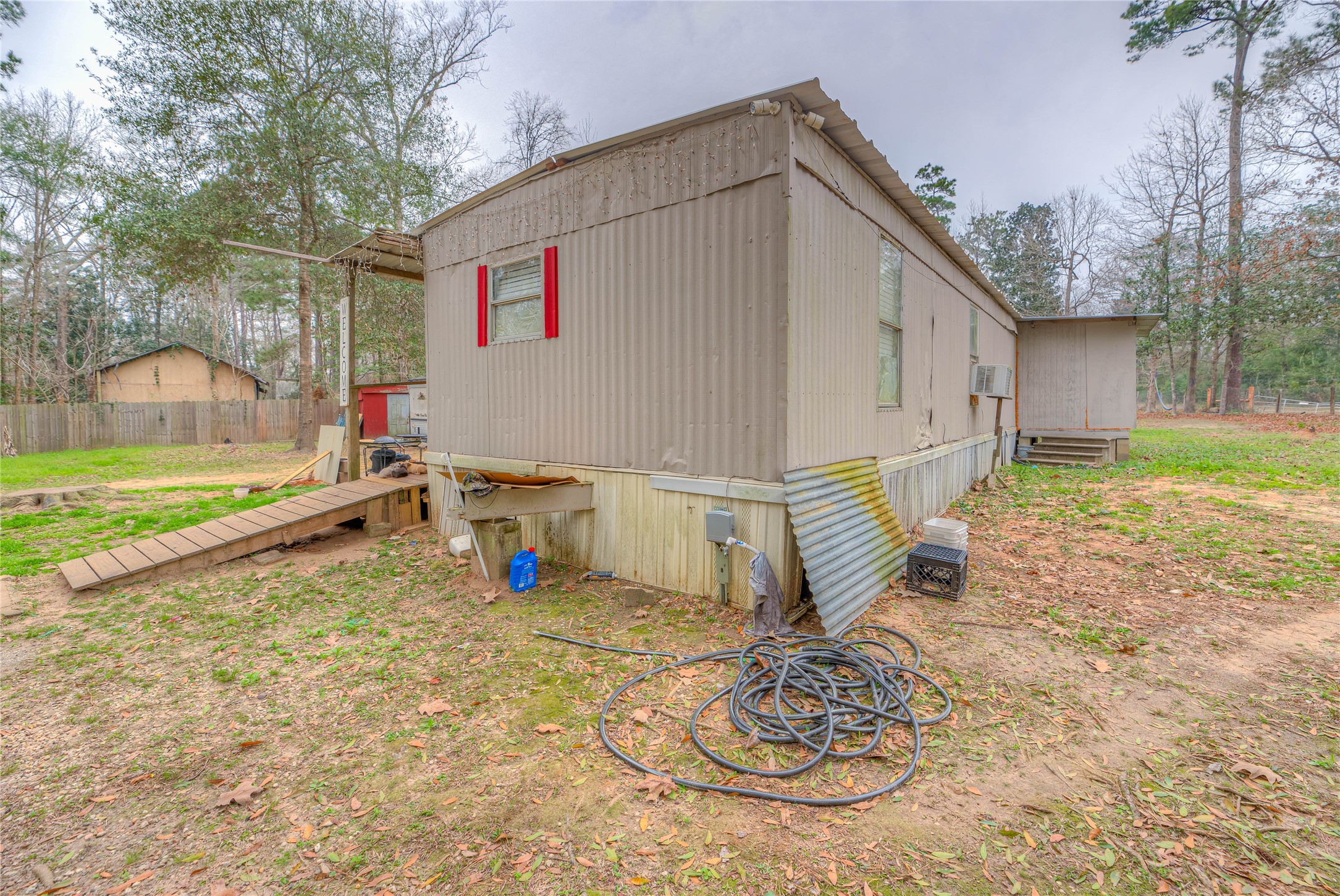 713 Garrett Road Livingston, TX 77351 - Photo 24 of 40 a house view with a backyard space