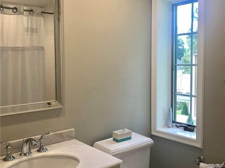 5 Rockcrest Road Manhasset, NY 11030 - Photo 13 of 16 Bathroom with toilet, plenty of natural light, vanity, and a shower with shower curtain